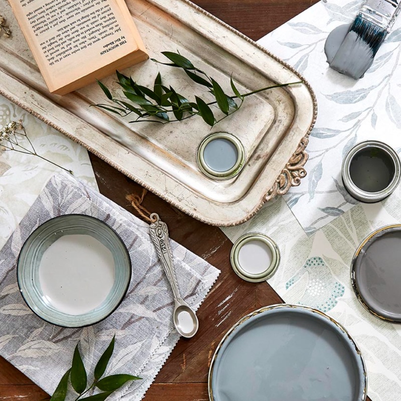 Light blue and grey sample pots of paint