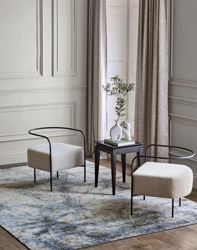 Blue and white marble effect rug in neutral tone room